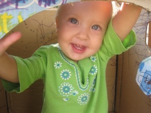Noa - playing in cardboard castle
